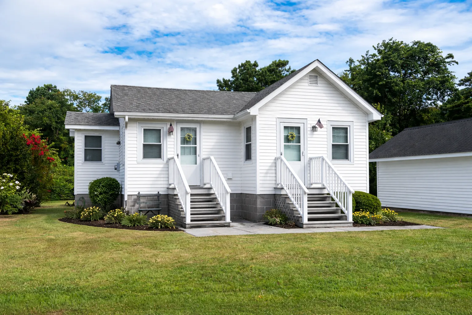 Remodeled detached accessory dwelling unit with upgraded exterior siding and modern entry improvements in Los Angeles California